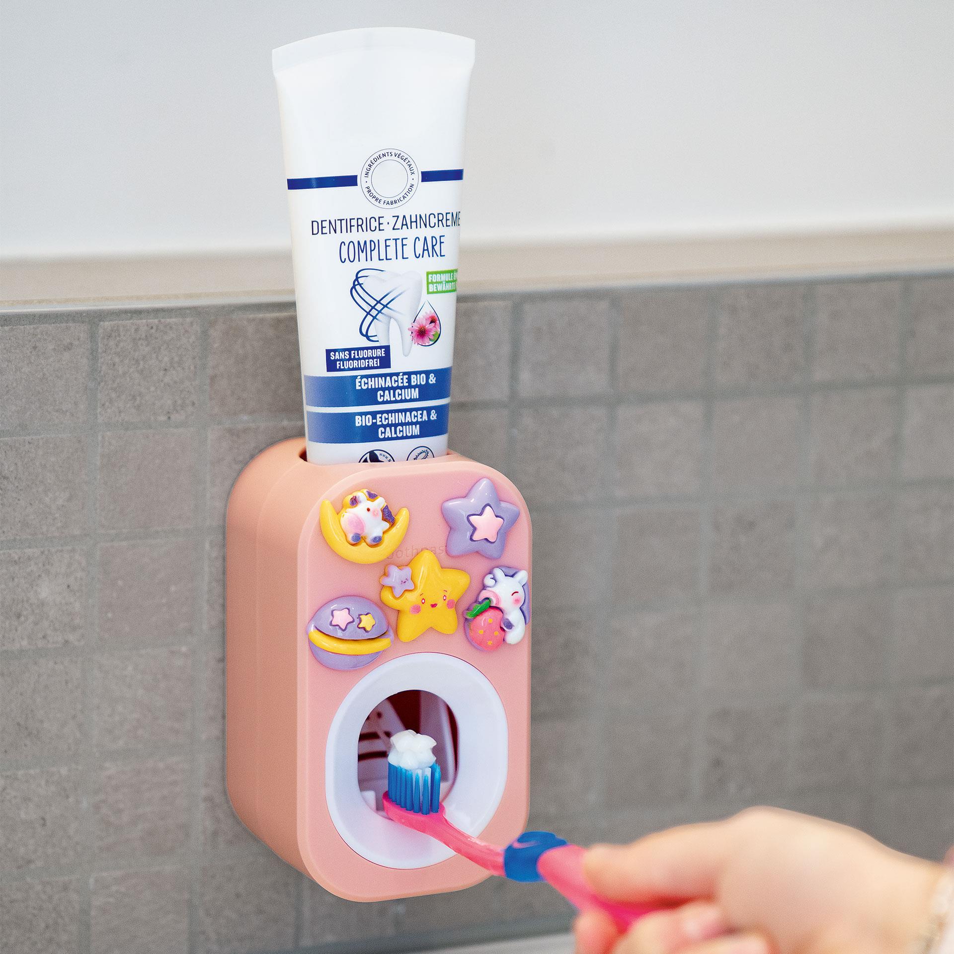 Distributeur de dentifrice rose avec design 3D, à coller au mur